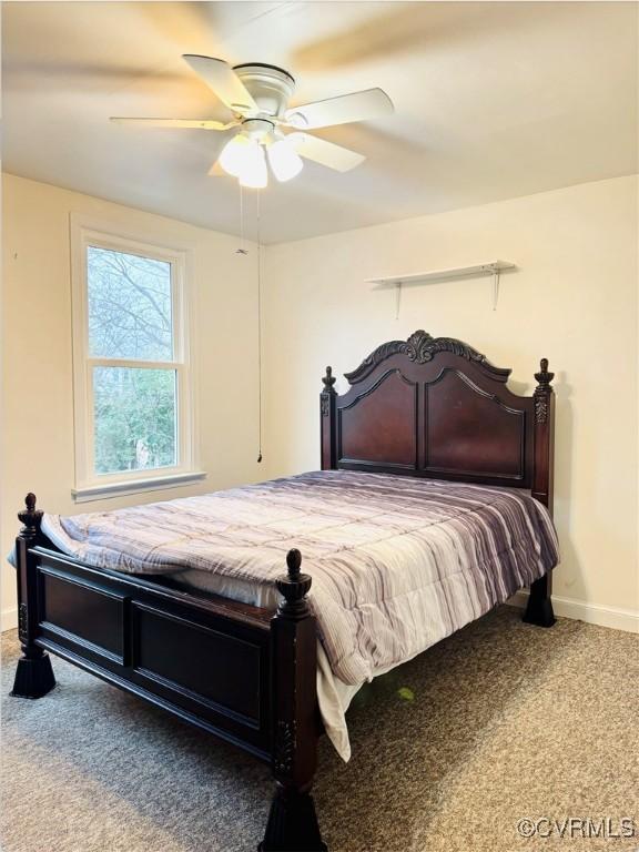 carpeted bedroom with ceiling fan