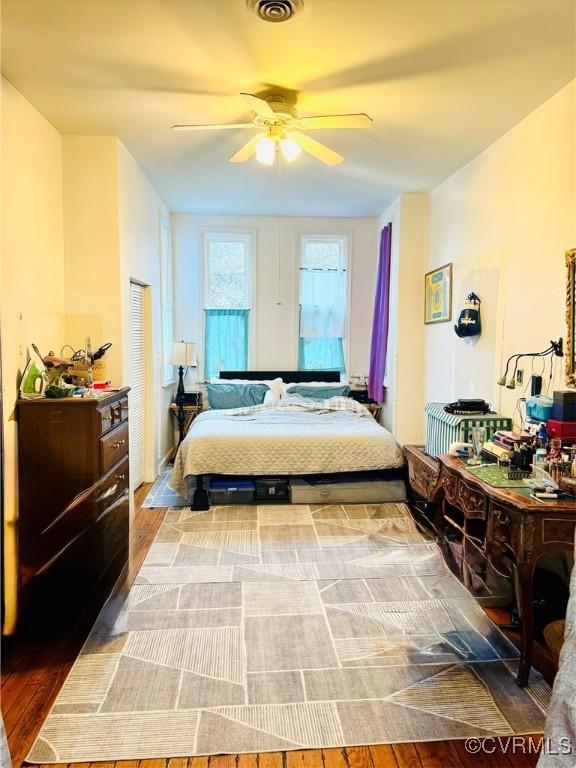 bedroom featuring hardwood / wood-style flooring and ceiling fan