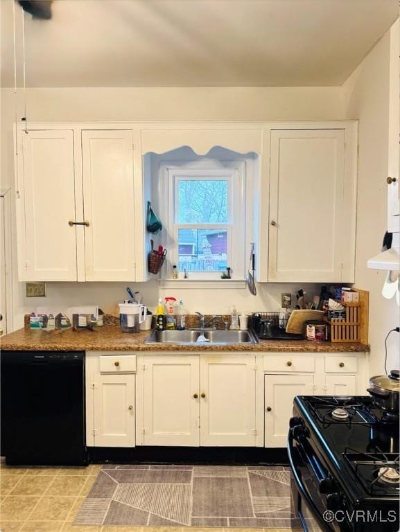 kitchen featuring white cabinetry, sink, and black appliances