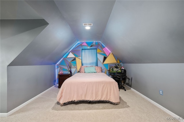 bedroom featuring carpet and vaulted ceiling