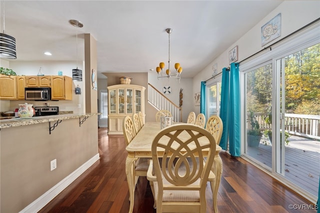 dining room with a chandelier and dark wood-type flooring