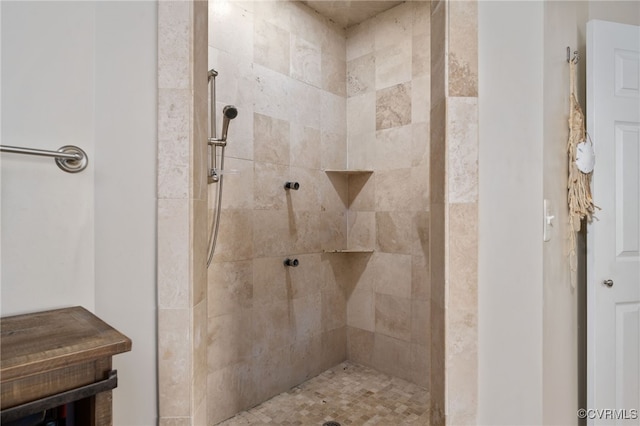 bathroom featuring a tile shower