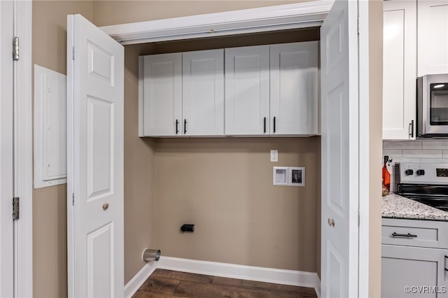 clothes washing area with washer hookup, dark hardwood / wood-style flooring, and electric dryer hookup