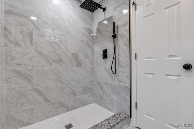 bathroom with tiled shower