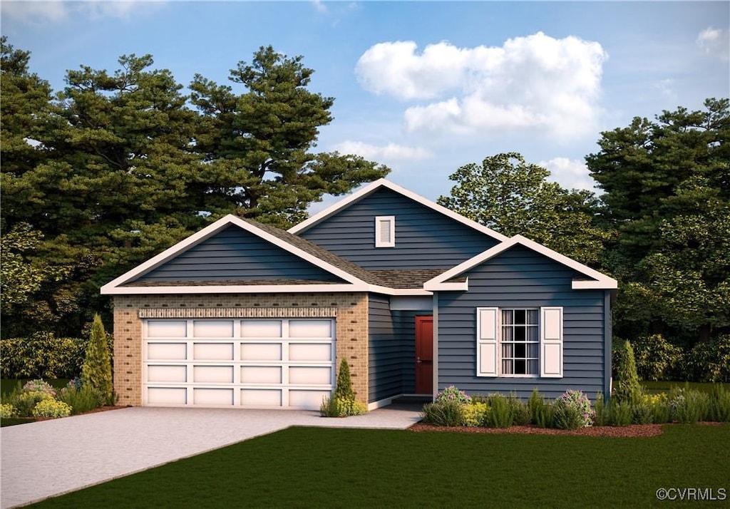 view of front of property featuring a garage and a front yard