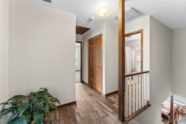 corridor featuring hardwood / wood-style flooring