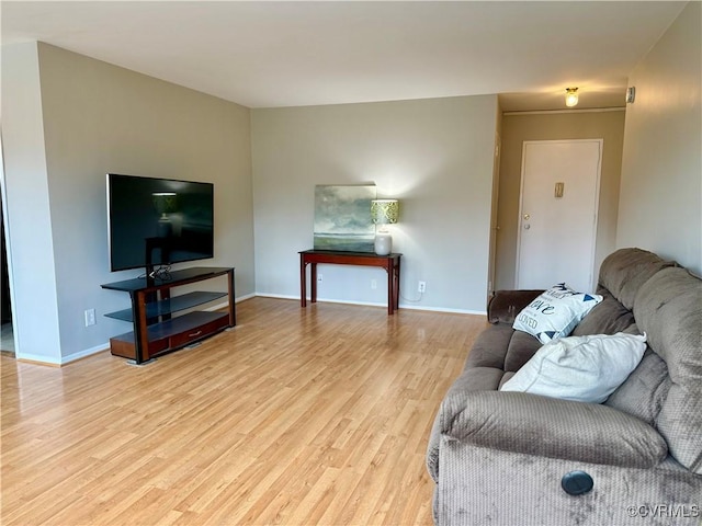 living room with light wood finished floors and baseboards