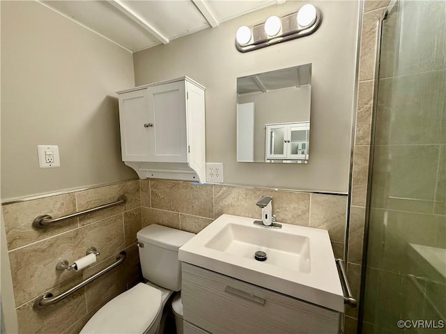 bathroom featuring a shower with door, toilet, tile walls, and vanity