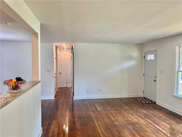 entrance foyer with dark hardwood / wood-style flooring