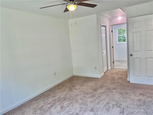 unfurnished room with light carpet and ceiling fan