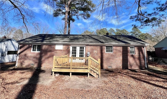 back of house with a wooden deck