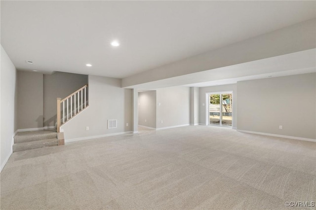 unfurnished living room with light carpet