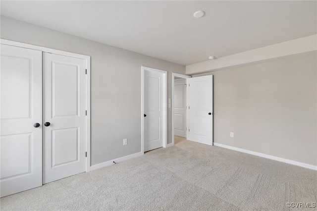 unfurnished bedroom with light colored carpet