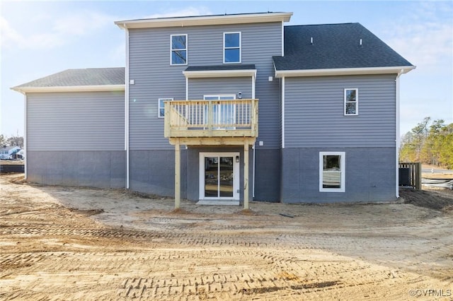 rear view of house with a balcony