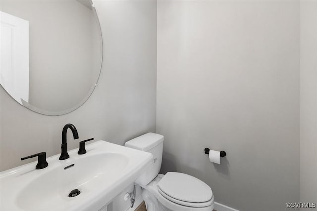 bathroom with sink and toilet