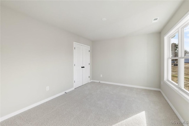 unfurnished room with carpet floors