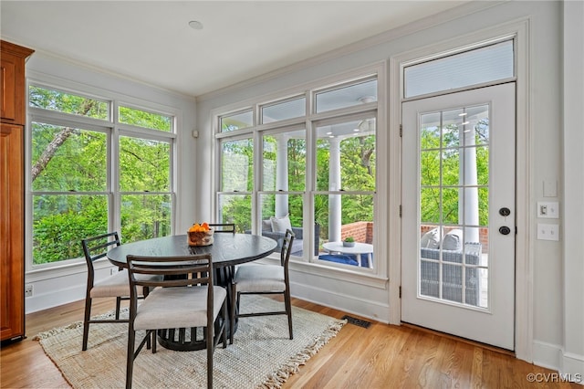 sunroom / solarium featuring visible vents