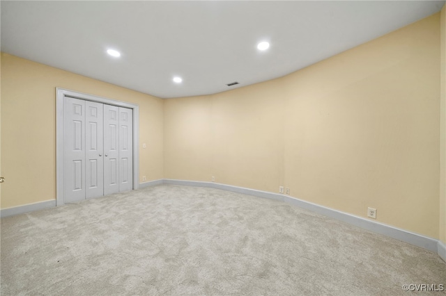 unfurnished bedroom with recessed lighting, carpet flooring, visible vents, baseboards, and a closet