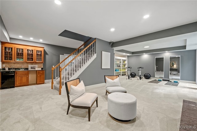 living area featuring indoor wet bar, recessed lighting, light carpet, baseboards, and stairs