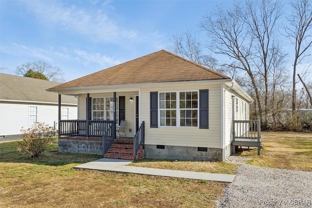 bungalow featuring a porch and a front yard