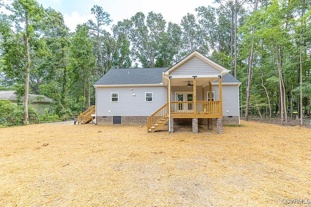 rear view of property with ceiling fan