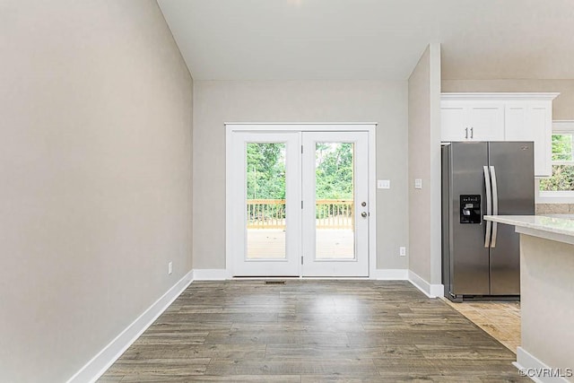 doorway to outside featuring wood-type flooring