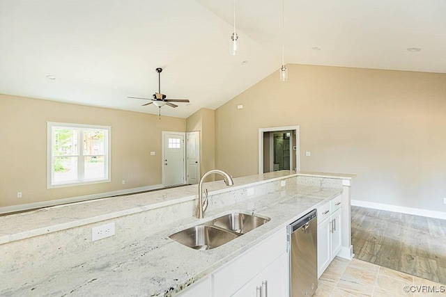 kitchen with white cabinetry, light stone countertops, sink, and stainless steel dishwasher