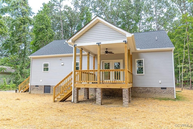 rear view of property featuring a wooden deck and ceiling fan