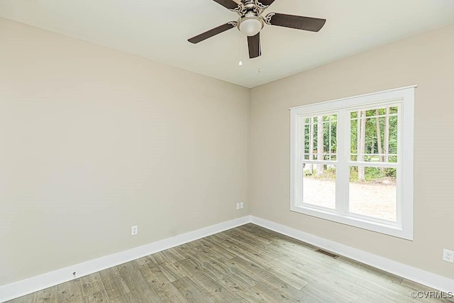 empty room featuring wood-type flooring and ceiling fan