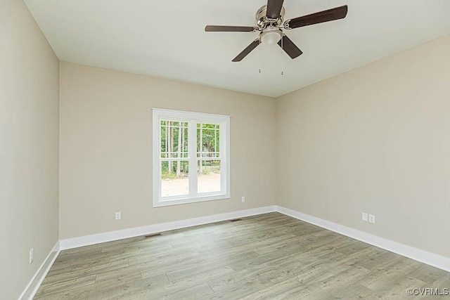 unfurnished room featuring ceiling fan and light wood-type flooring