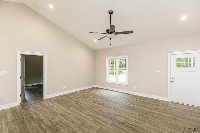 unfurnished living room with high vaulted ceiling, dark hardwood / wood-style floors, and ceiling fan