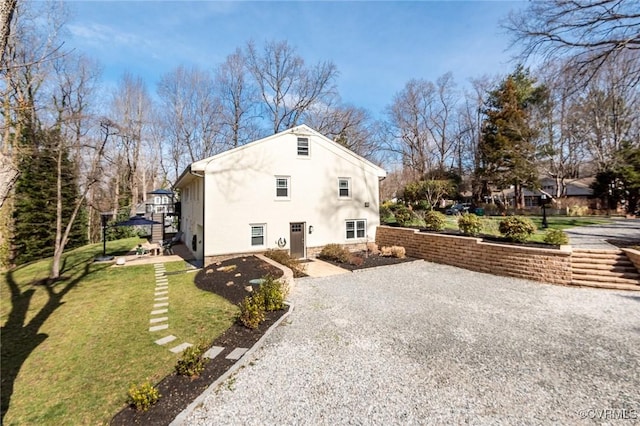 view of home's exterior with a yard