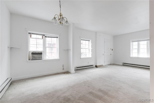 unfurnished room featuring light carpet, an inviting chandelier, and baseboard heating