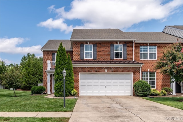 view of front of house featuring a garage and a front yard