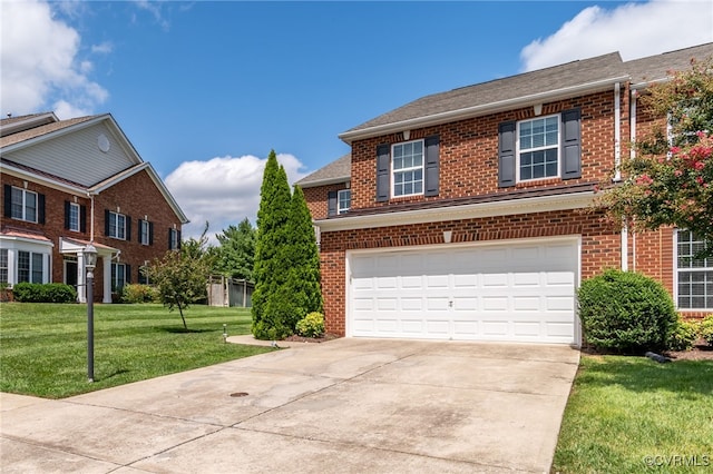 view of front of house with a garage and a front yard