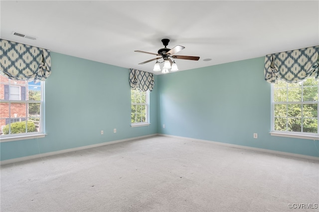 spare room featuring ceiling fan and carpet flooring