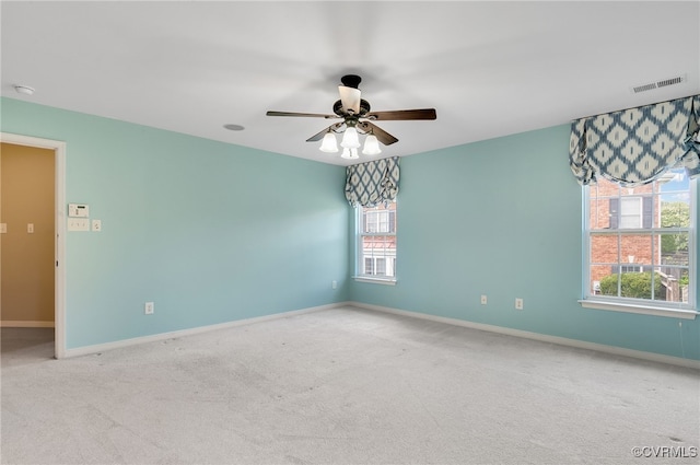 carpeted empty room featuring ceiling fan