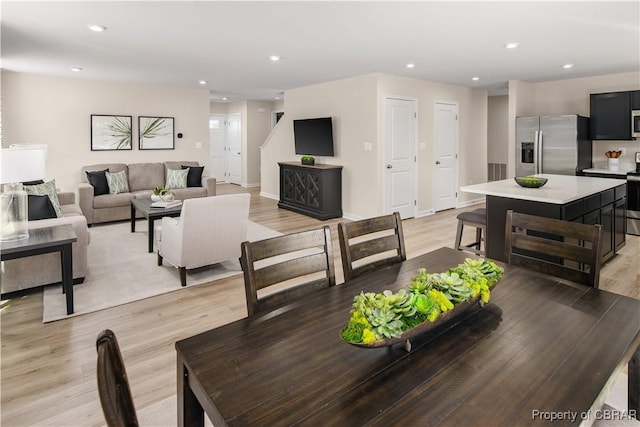 dining space featuring light hardwood / wood-style flooring