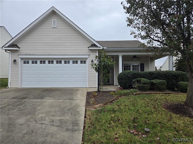 single story home featuring a garage and ceiling fan