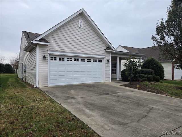 view of front of property with a garage and a front yard