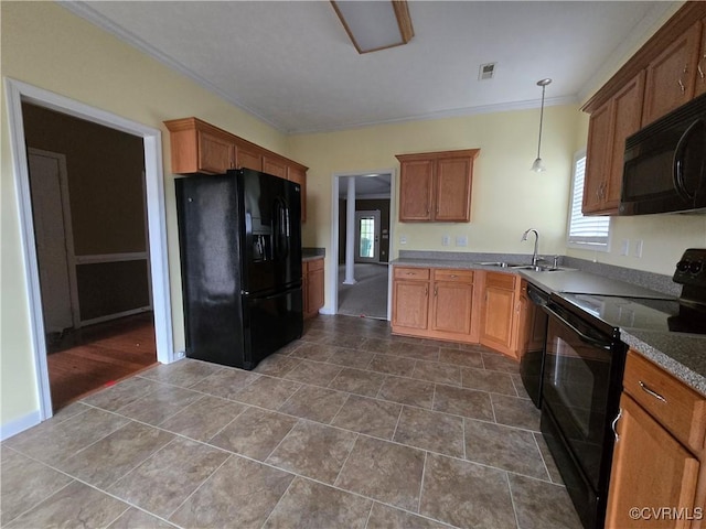 kitchen with pendant lighting, ornamental molding, sink, and black appliances