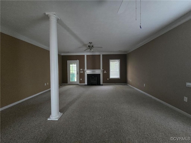 unfurnished living room with ornate columns, ornamental molding, carpet, and ceiling fan