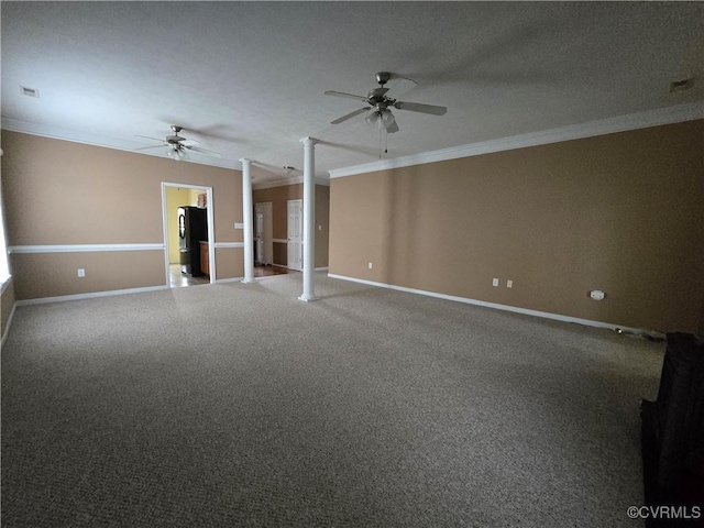 carpeted empty room with crown molding, ceiling fan, decorative columns, and a textured ceiling