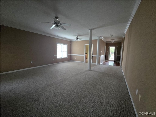 spare room with decorative columns, crown molding, carpet floors, and ceiling fan