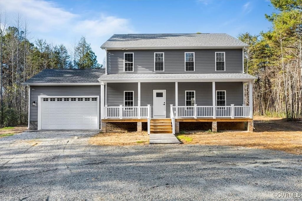 view of front facade featuring a garage and covered porch