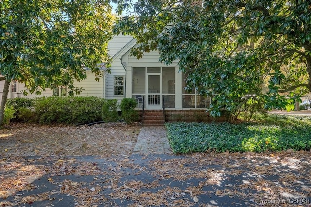 exterior space featuring a sunroom