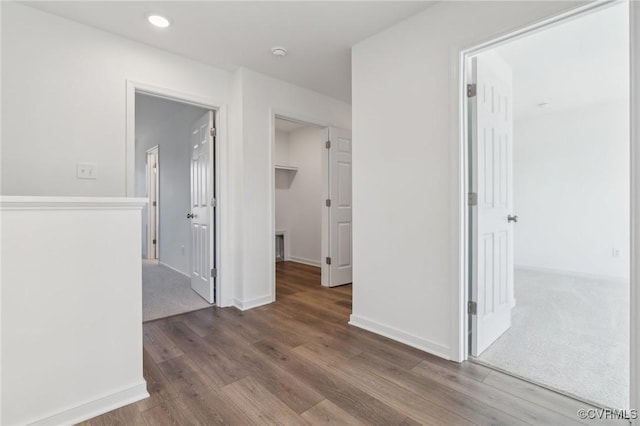 hall with wood-type flooring