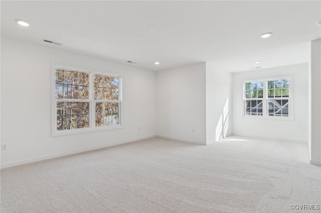 empty room with light colored carpet