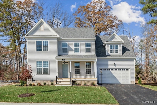 view of front of home featuring a porch, a garage, and a front lawn