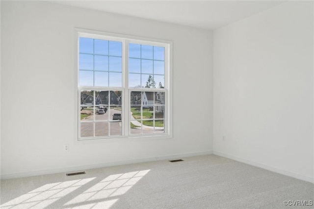 unfurnished room featuring carpet